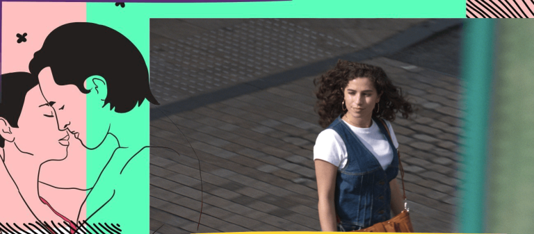 Woman in a jeansdress crossing a street